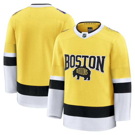 Sports Jersey Direct Boston Bruins 2026 Stadium Series premium gold hockey jersey with black and white sleeve stripes.